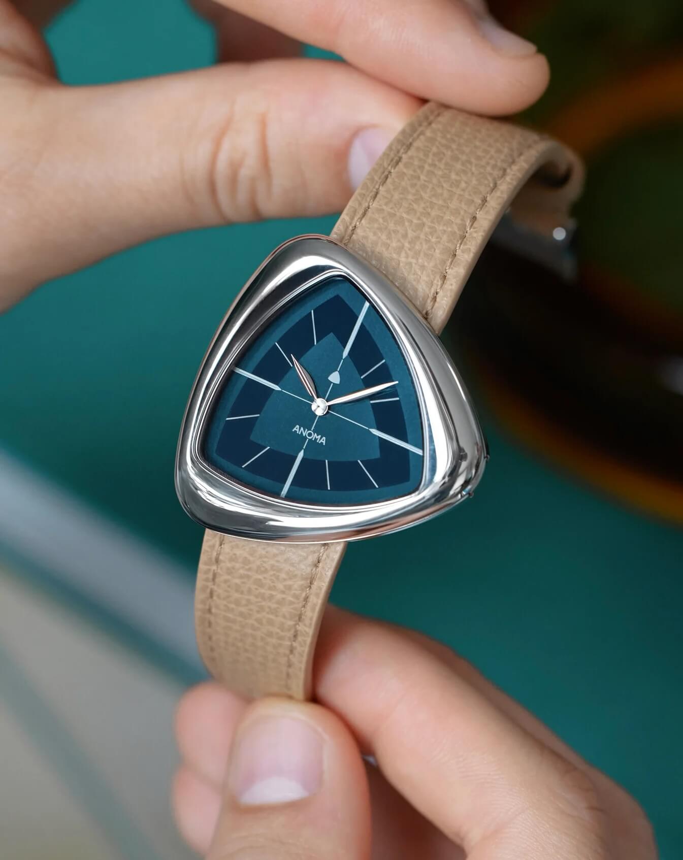 Anoma A1 rounded triangular steel watch on a grained Italian leather strap