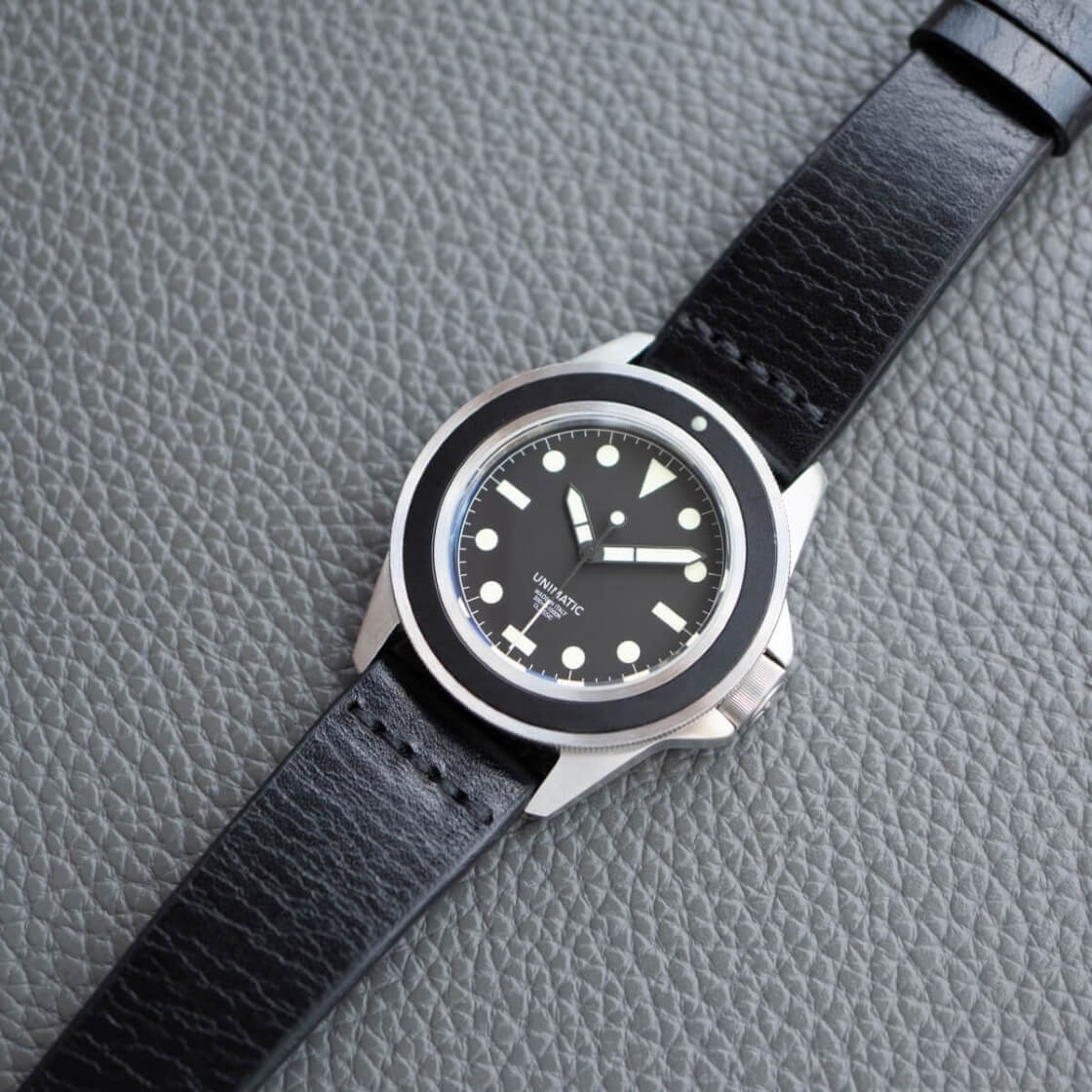 black strap on a diver watch