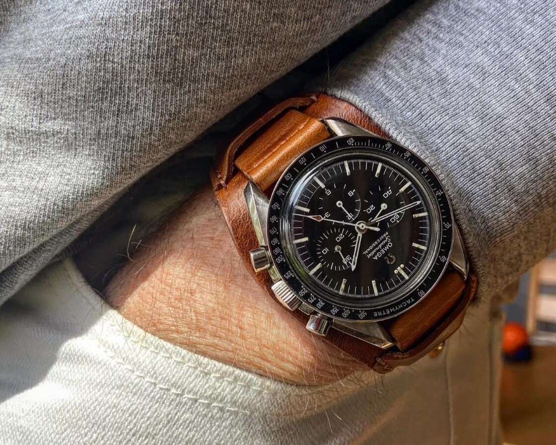 omega speedmaster on brown leather bund strap