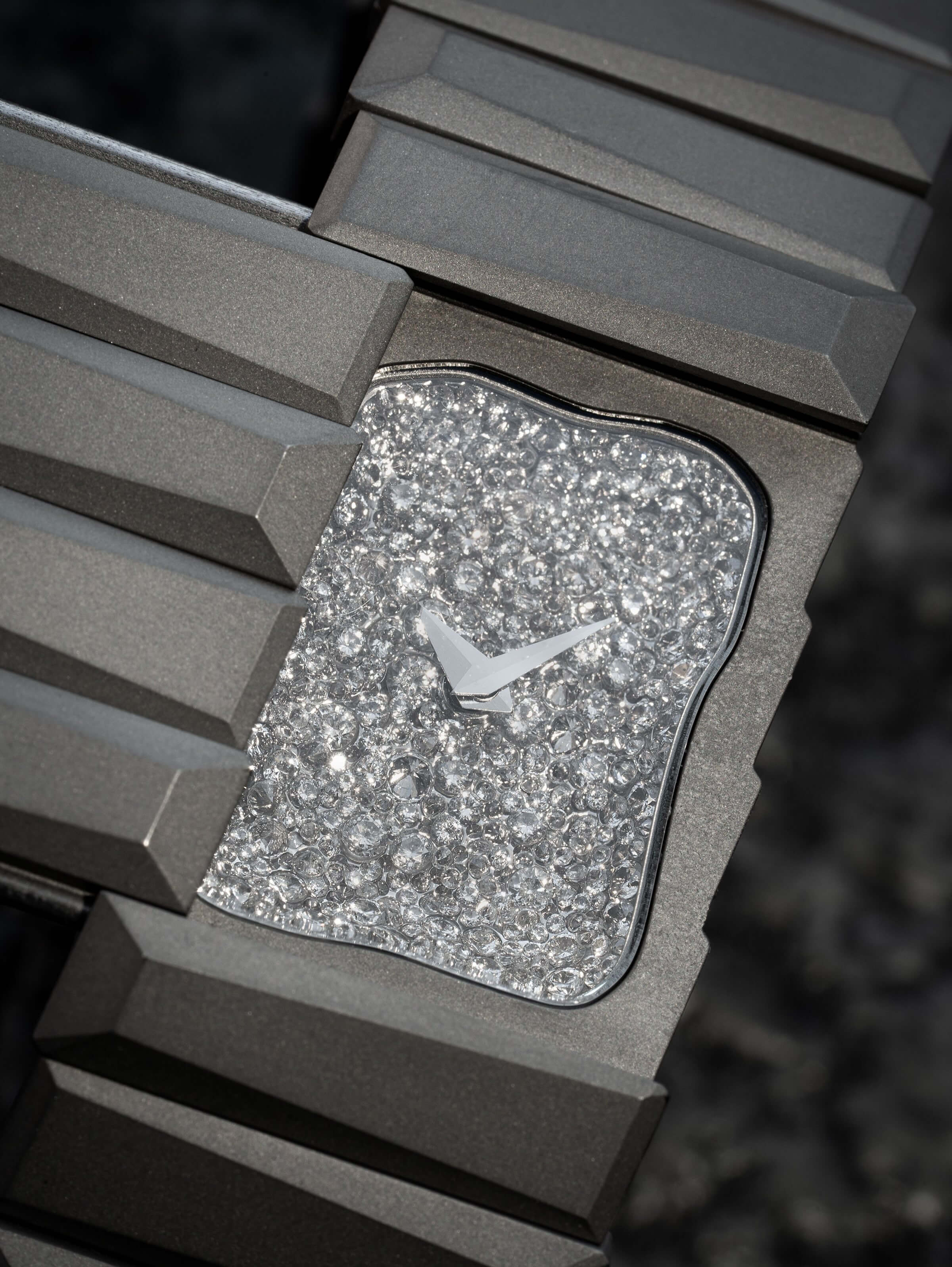 Toledano and Chan Oshinobi with the cover slid open showing the snow-set diamond dial