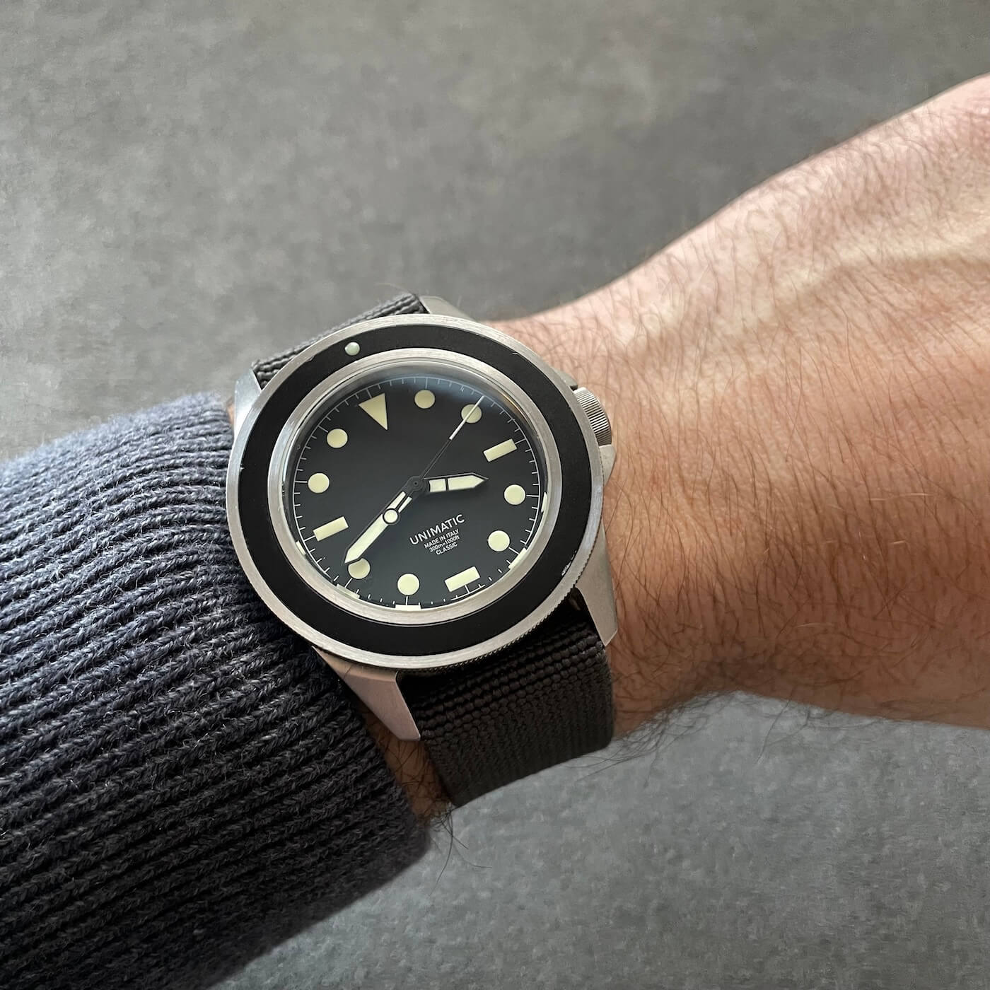 grey elastic strap on unimatic watch