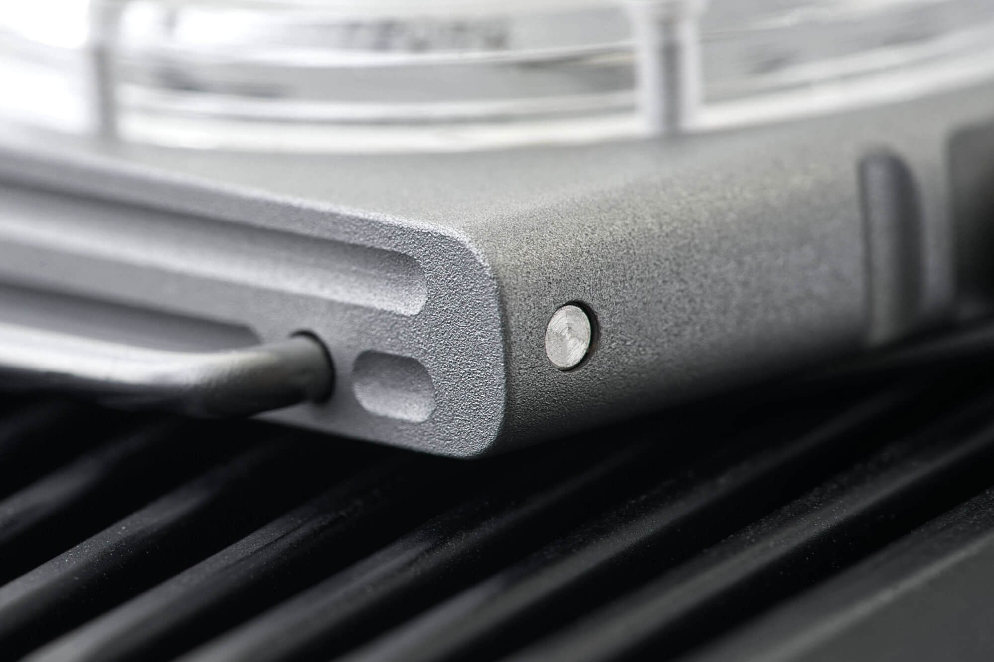 button on the side of the E.C. Andersson Timepod case