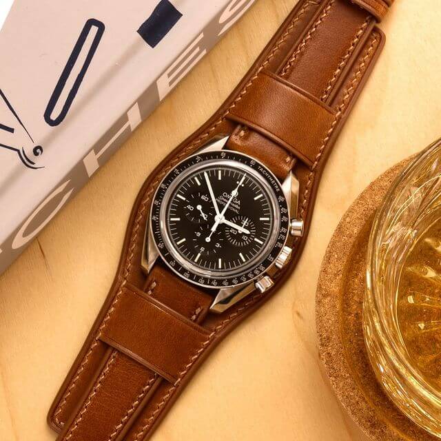 Omega Speedmaster on brown bund strap by Velle Alexander