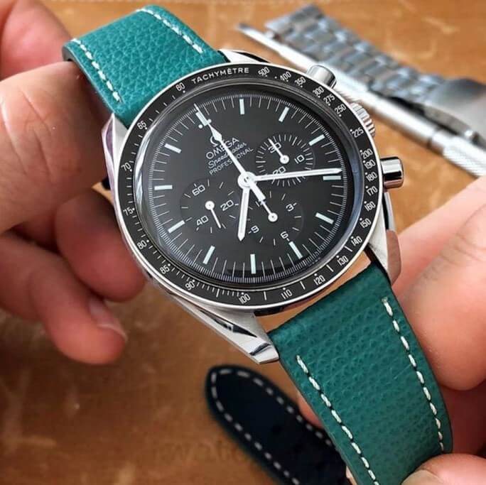 Omega Speedmaster on green leather watch strap by Watchbandit